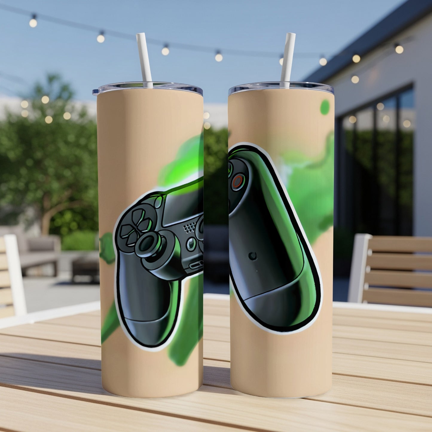 Two tall, tan tumblers featuring a black video game controller with green accents.