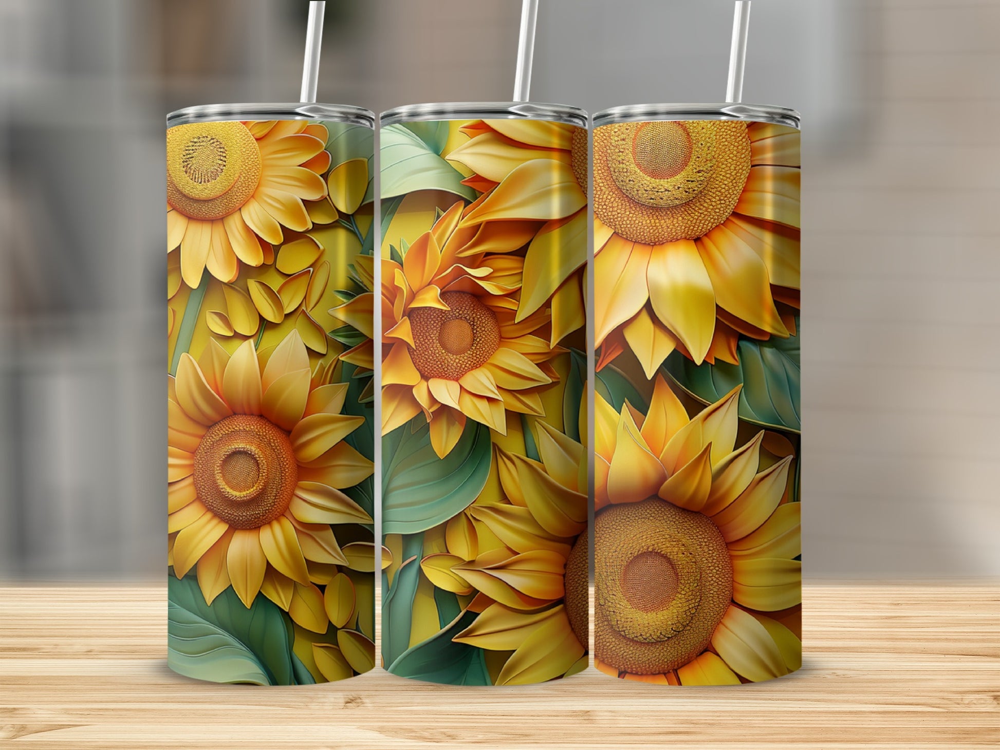 Three tumblers with a vibrant sunflower and green leaf pattern.