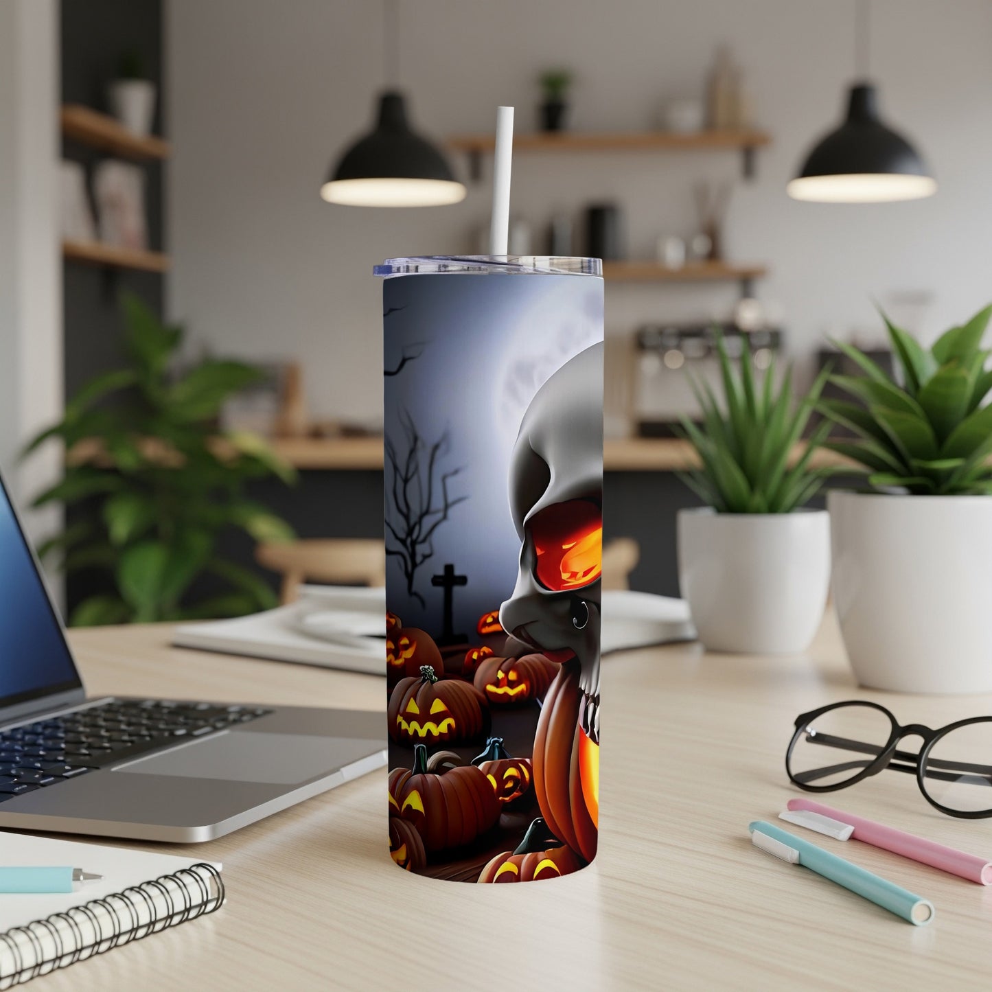 Tumbler with Halloween skull and jack-o'-lanterns design, featuring a graveyard scene.