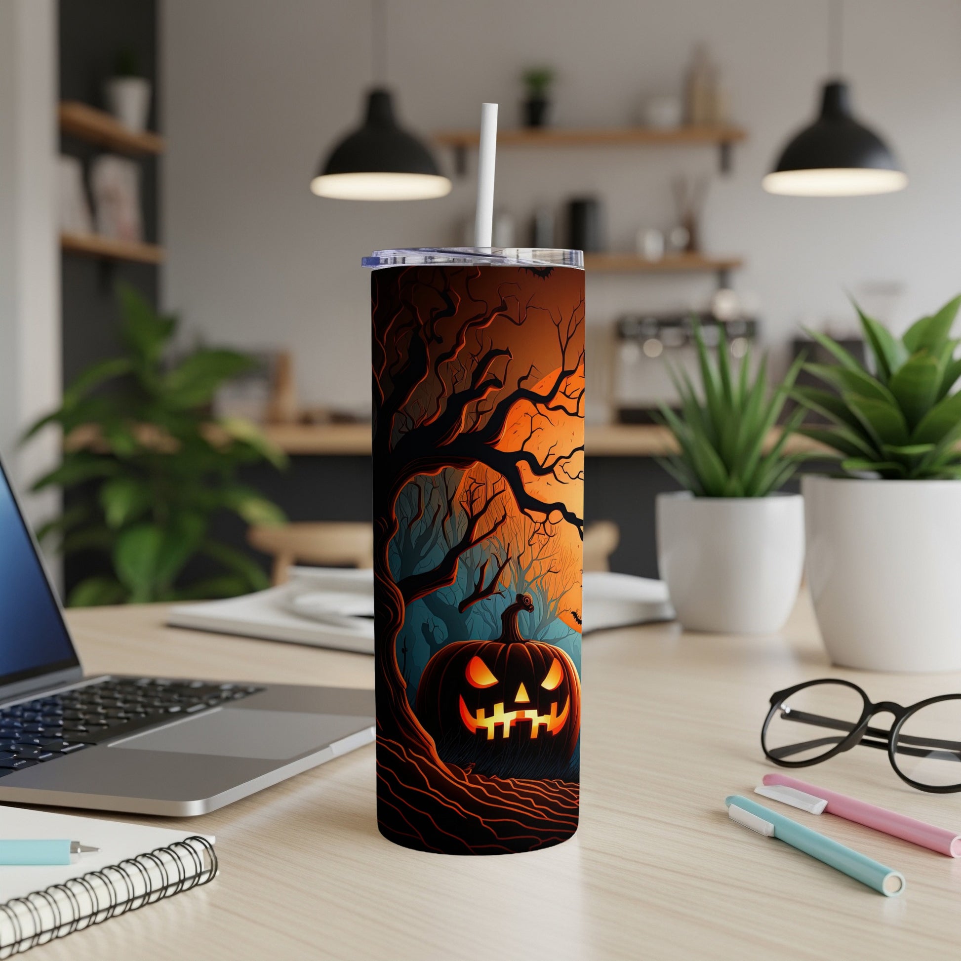 Tumbler with a Halloween scene featuring a Jack-o'-lantern and spooky trees.