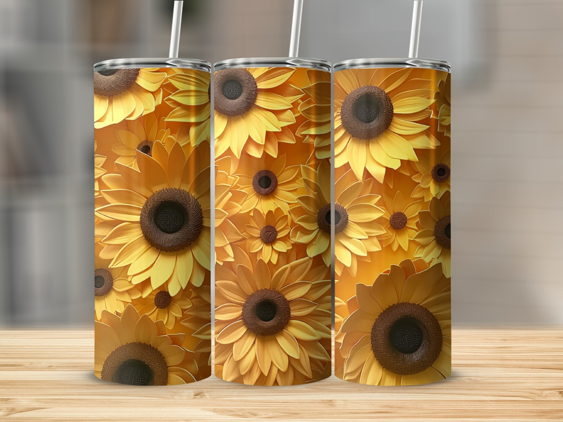 Three tumblers decorated with a pattern of yellow and brown sunflowers.