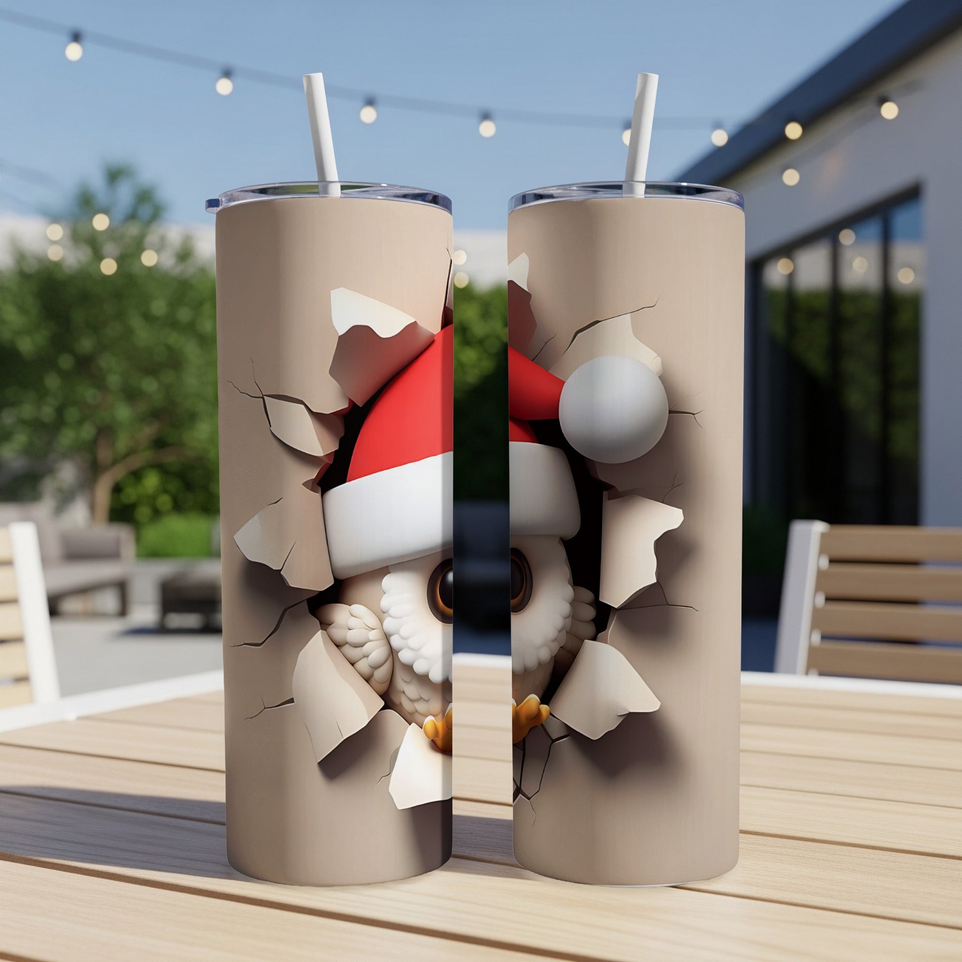 Two tan tumblers with cartoon owl wearing Santa hat breaking through surface.