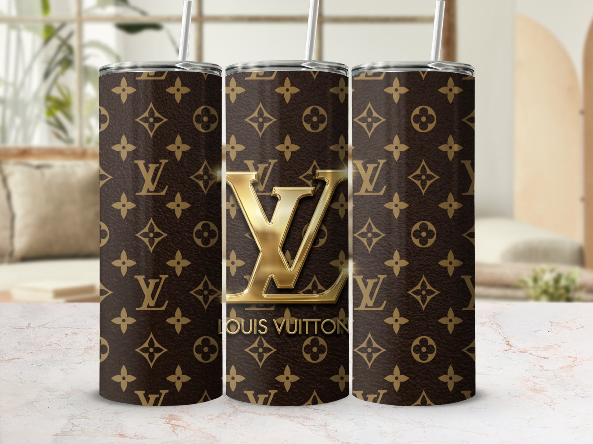 Three tumblers with brown Louis Vuitton monogram and gold LV logo.