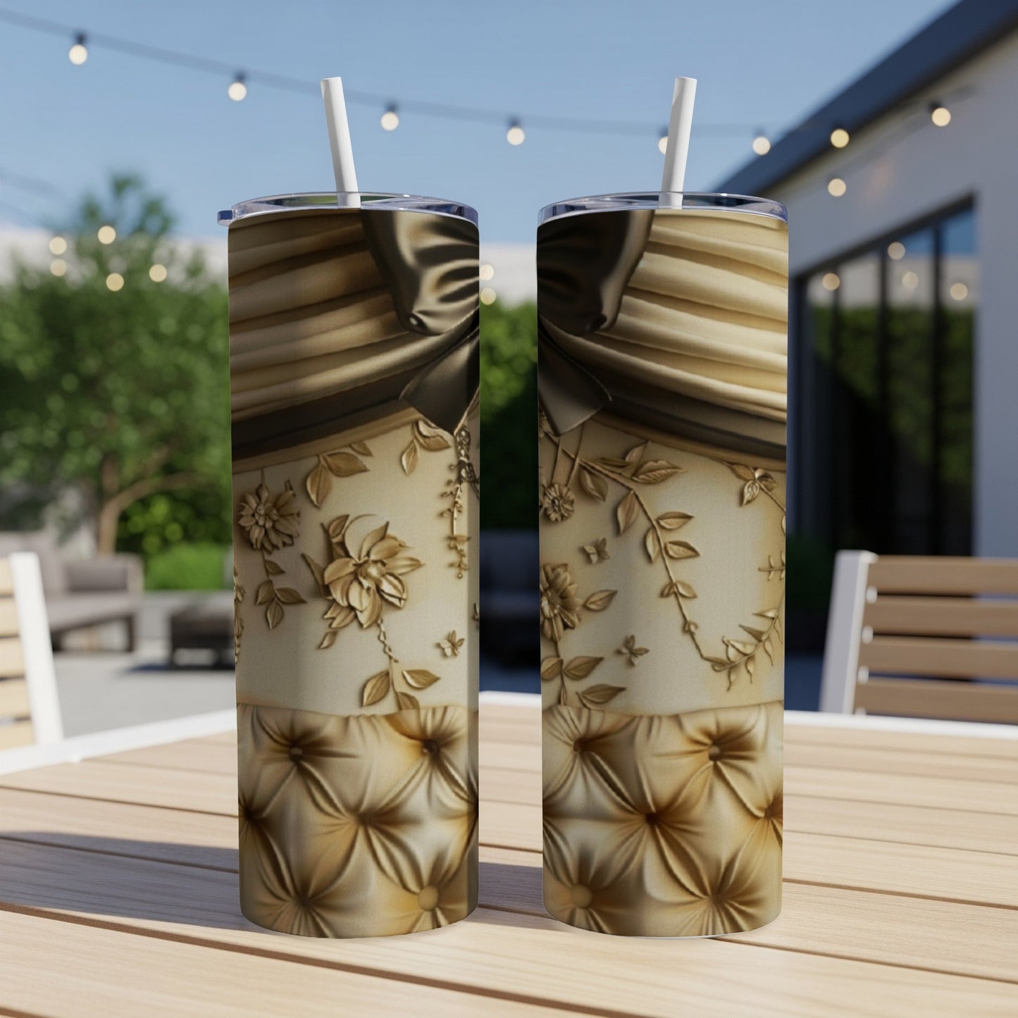 Two champagne gold tumblers with intricate floral and knot designs.