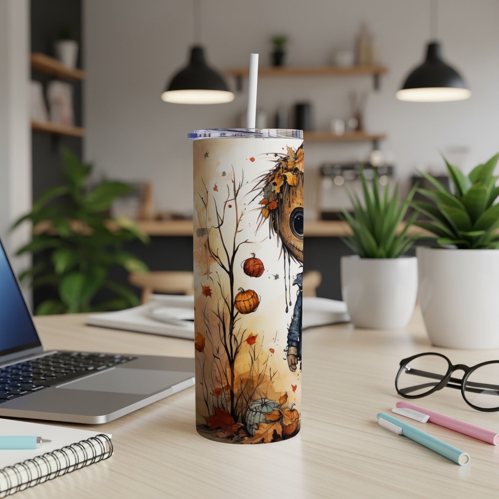 Tumbler with watercolor scarecrow, pumpkins, and falling leaves design.