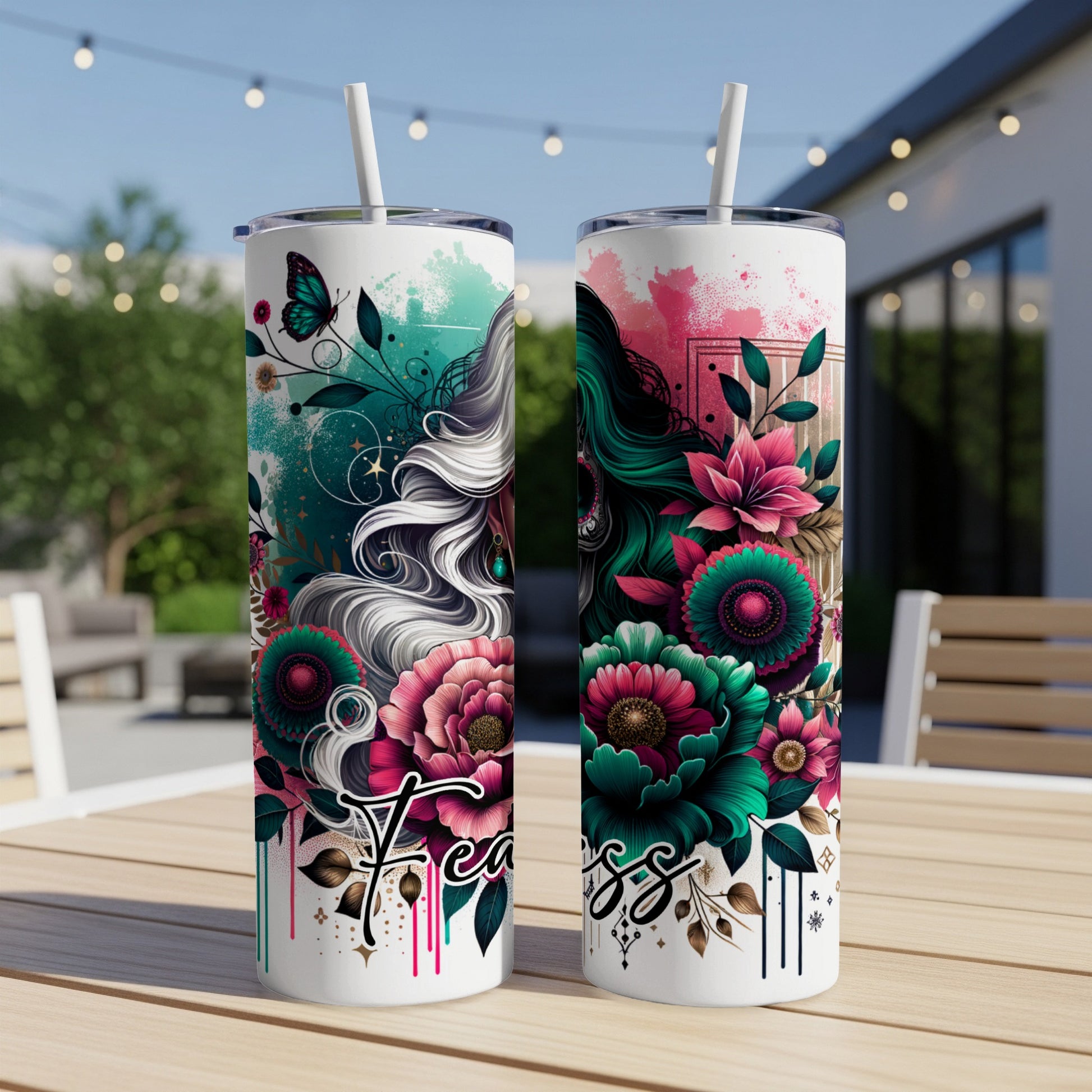 Two tumblers with floral skull designs and the word "Fearless".