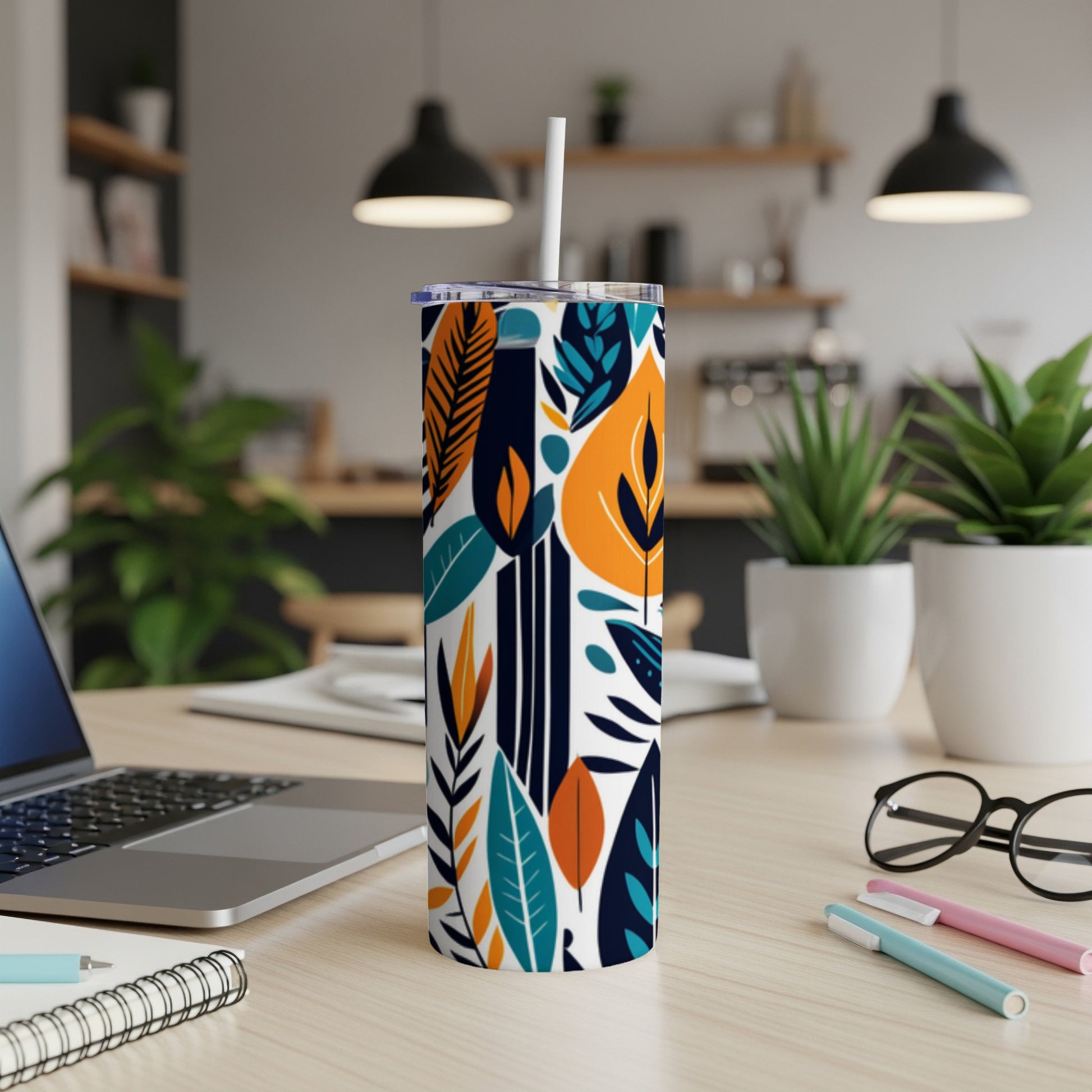 Tall tumbler with a colorful abstract leaf and stem pattern.