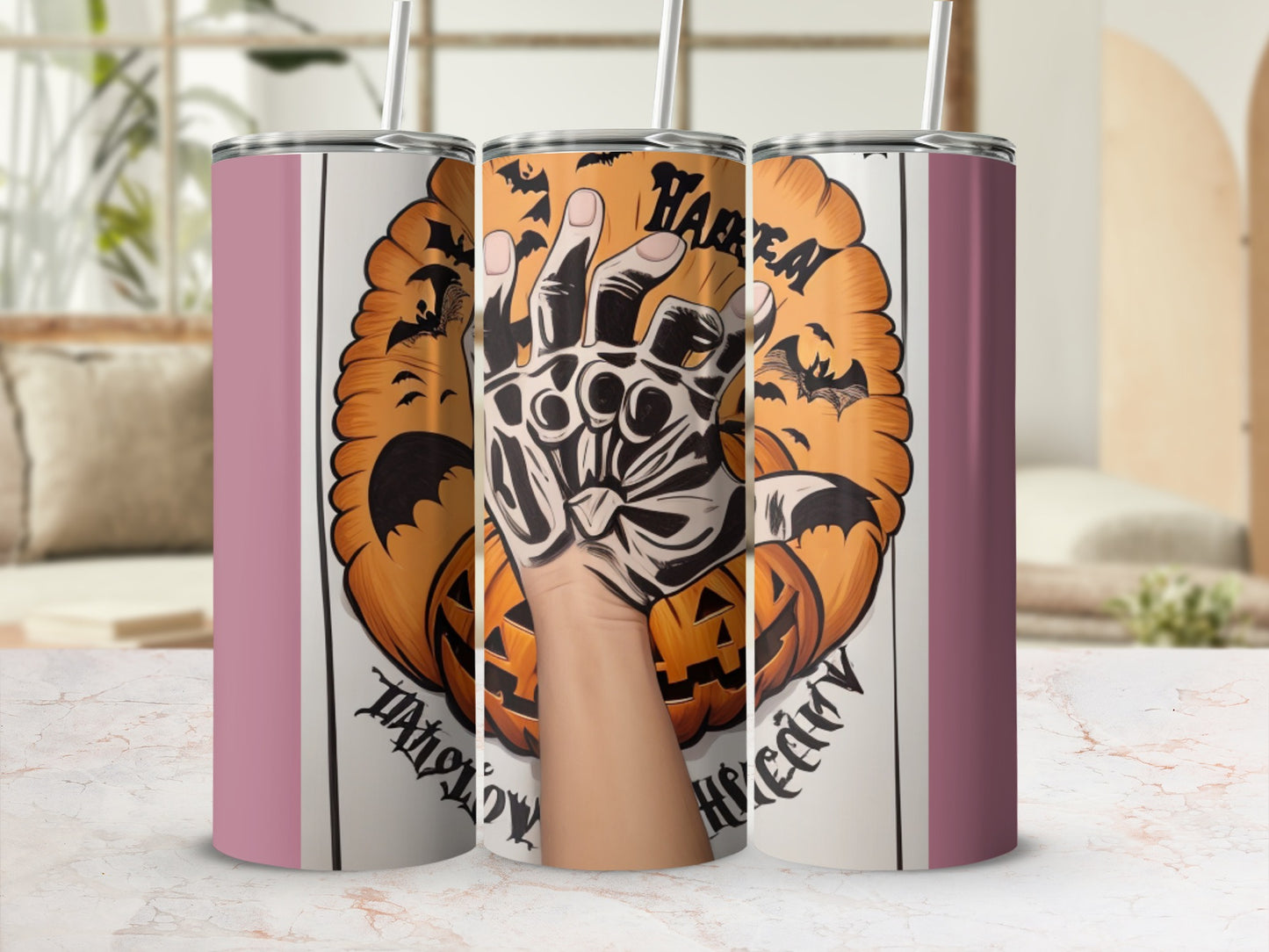 Halloween themed tumblers with pumpkins, bats, and a skeleton hand.