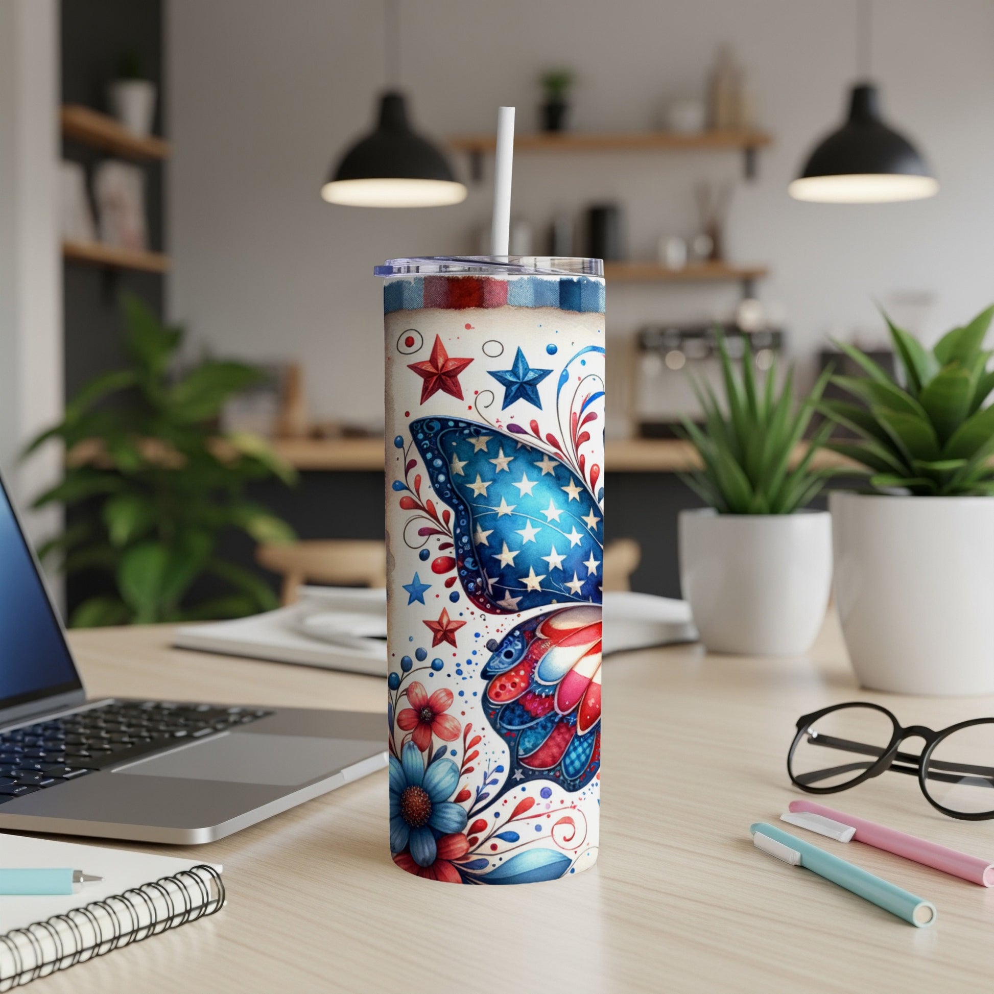Tumbler with red, white, and blue butterfly and star patriotic design.