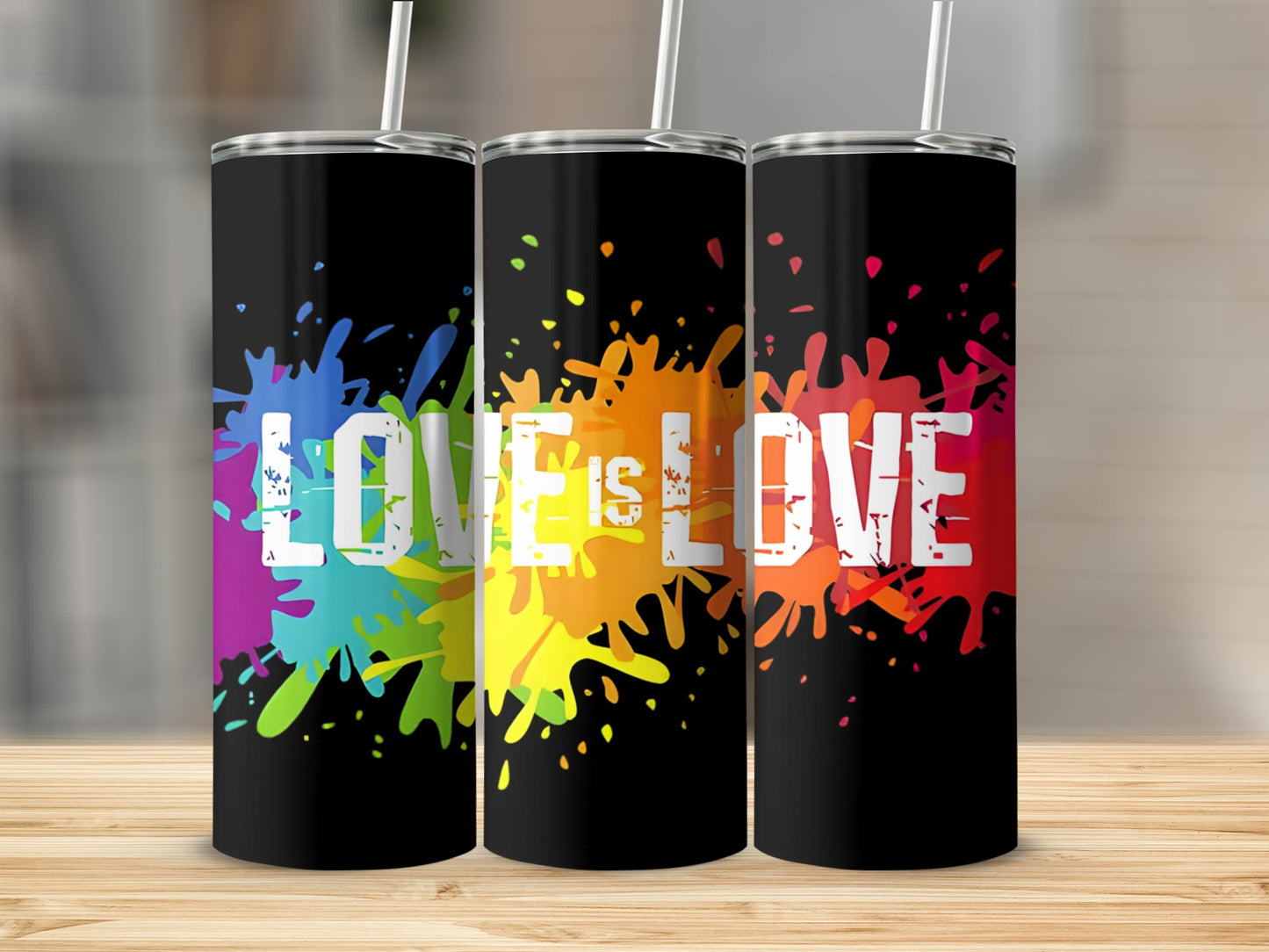 Three black tumblers with "LOVE IS LOVE" in colorful paint splatters.
