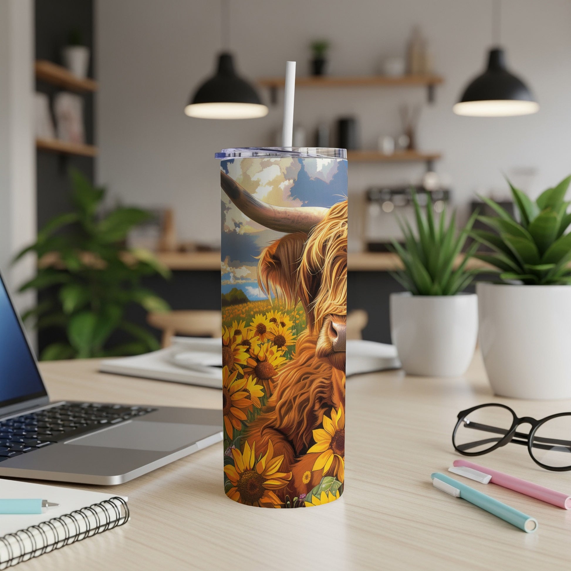 Highland cow in a field of sunflowers on a tumbler cup.