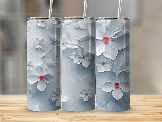 Three tumblers with embossed white floral designs and red flower centers.