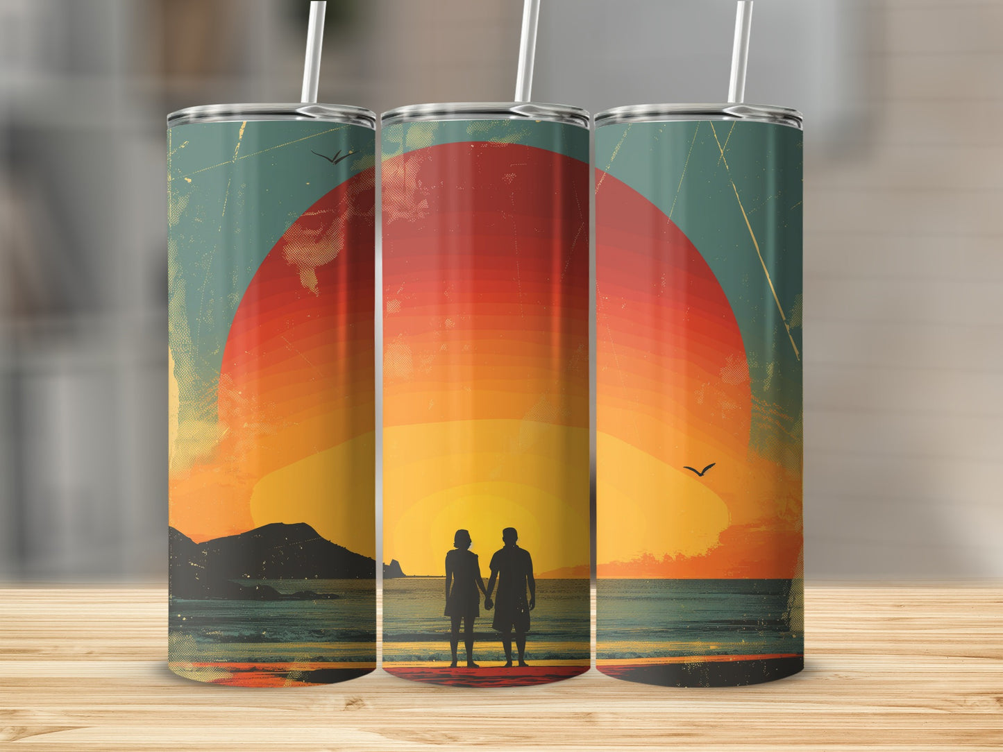 Couple holding hands on a beach with a large sunset behind them.