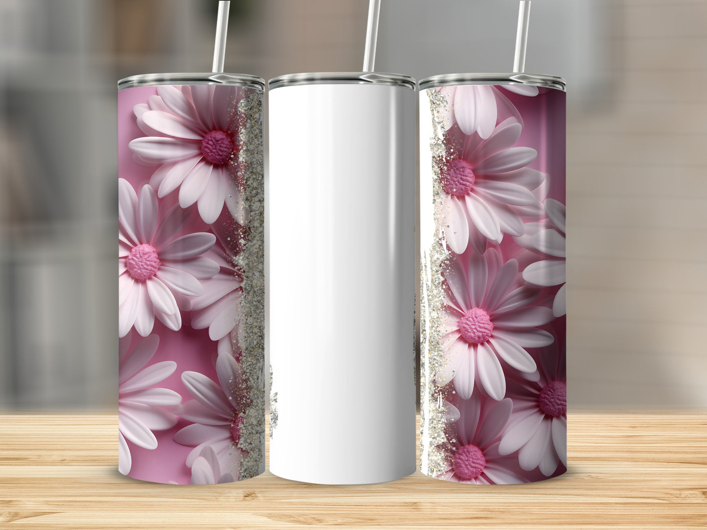 Three tumblers with pink flowers and glitter on a wooden surface.
