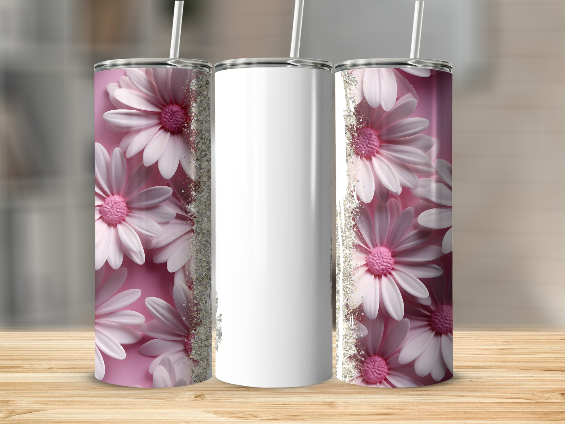 Three tumblers with pink flowers and glitter on a wooden surface.