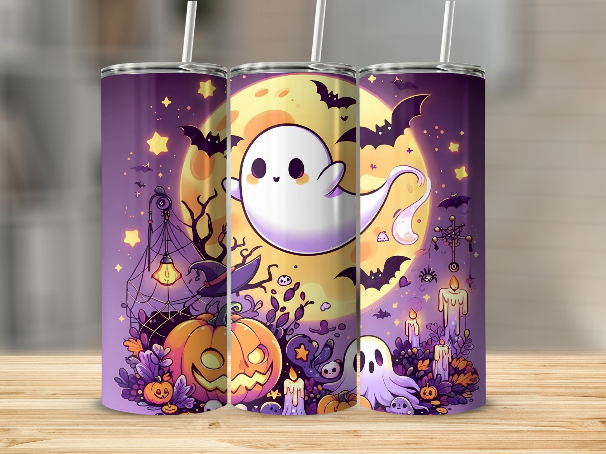 Three tumblers with a cute Halloween design featuring ghosts, pumpkins, bats, and a full moon.