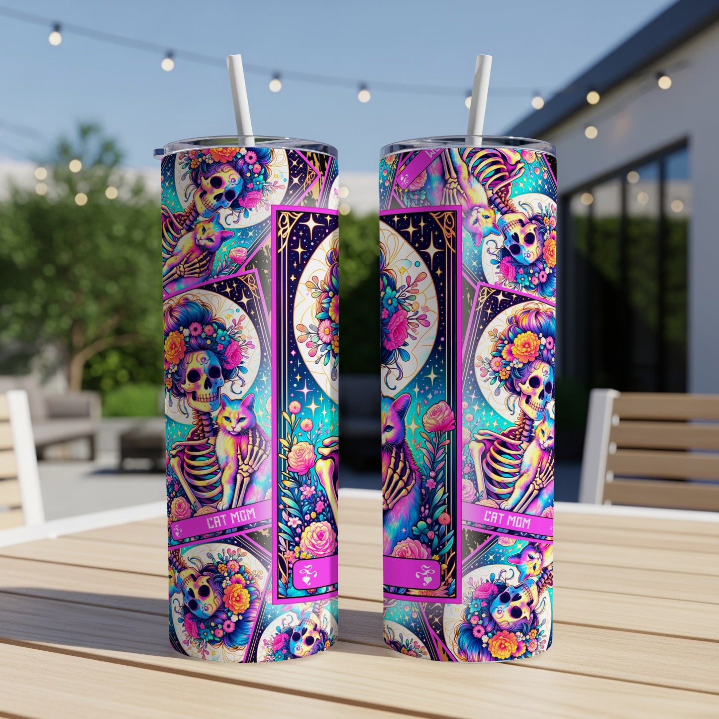 "Cat Mom" tumbler with colorful skulls, cats, and floral designs.