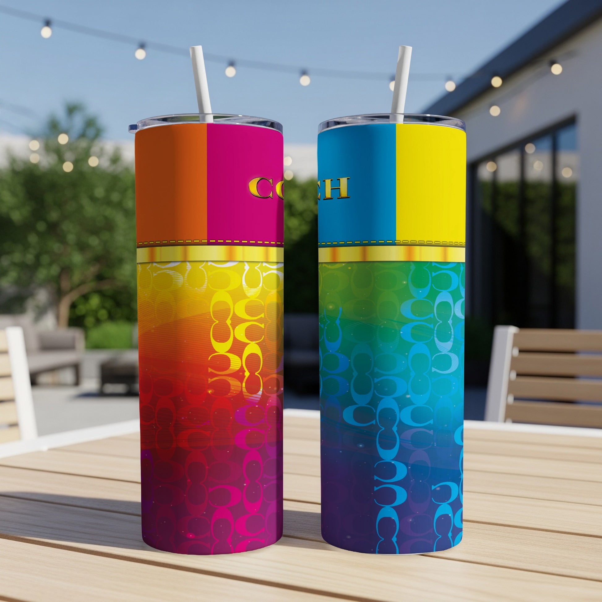 Two tumblers with rainbow gradient patterns and Coach logo sit on a table outdoors.