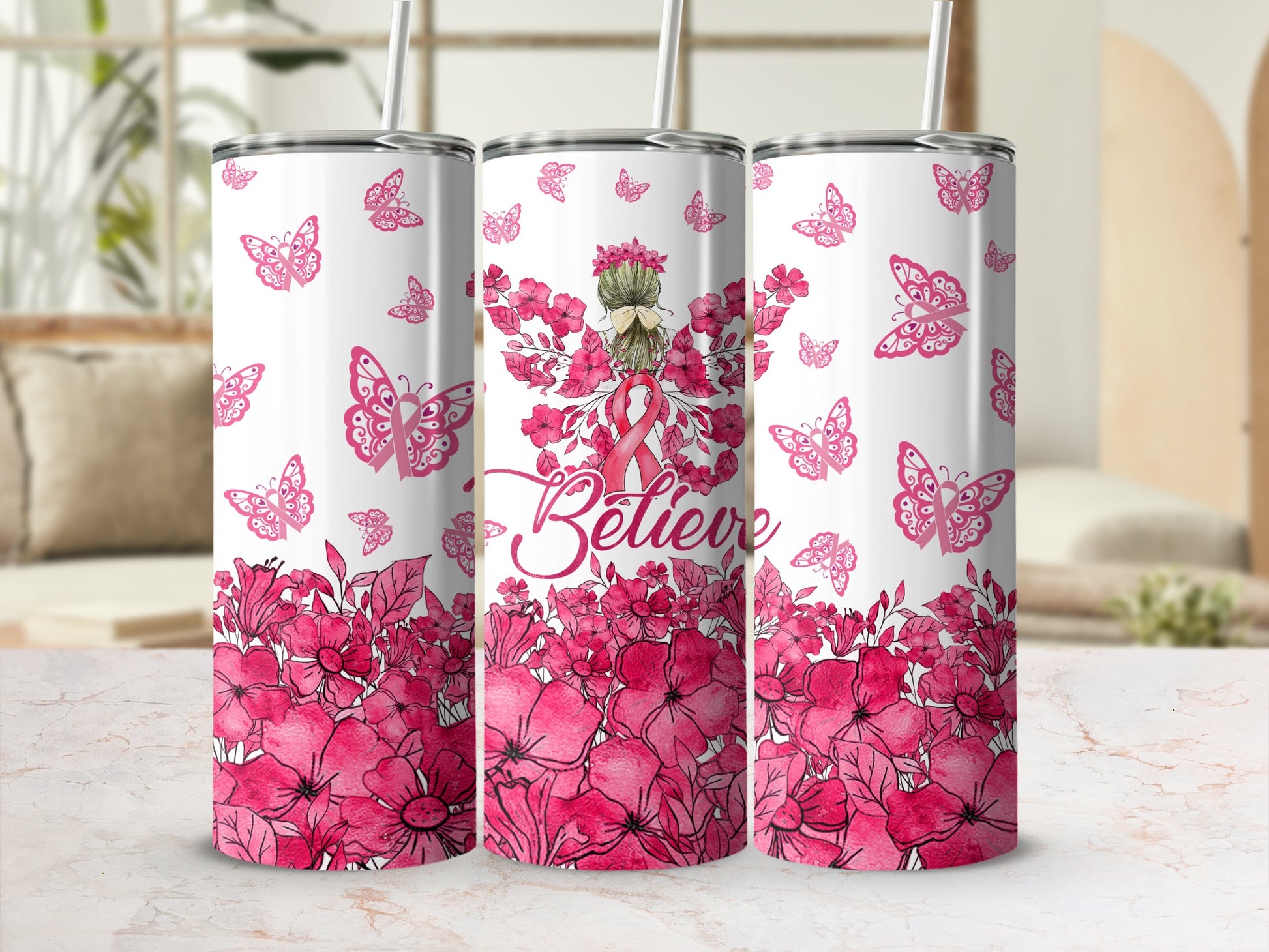 Pink butterflies, flowers, and "Believe" text on a tumbler.