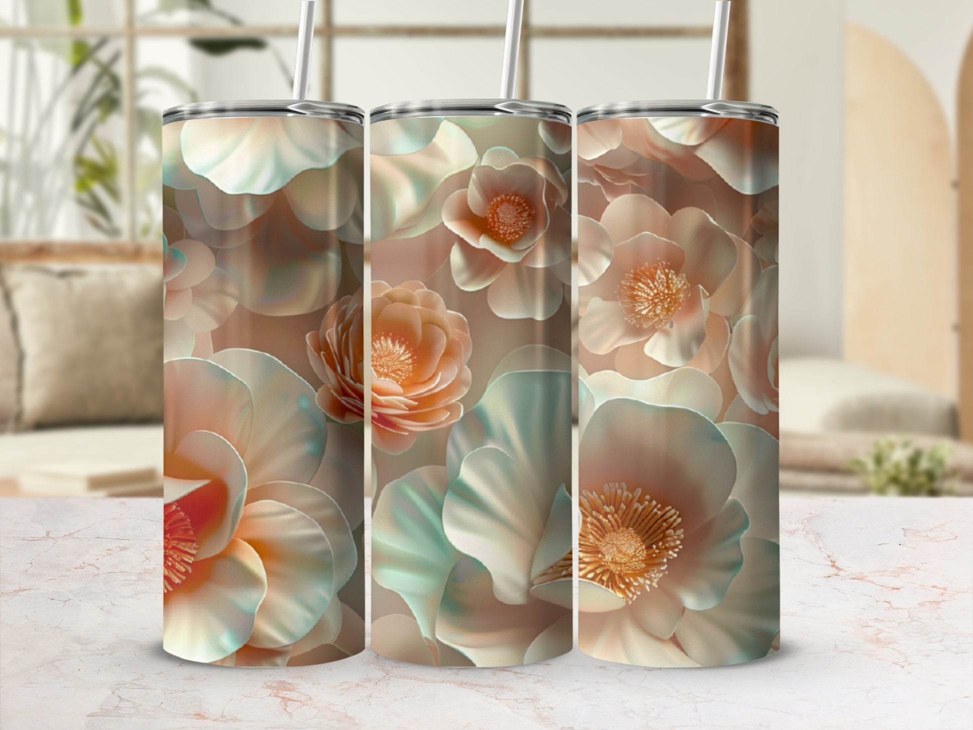 Triptych of tumblers with large, stylized floral patterns in soft peach and teal.