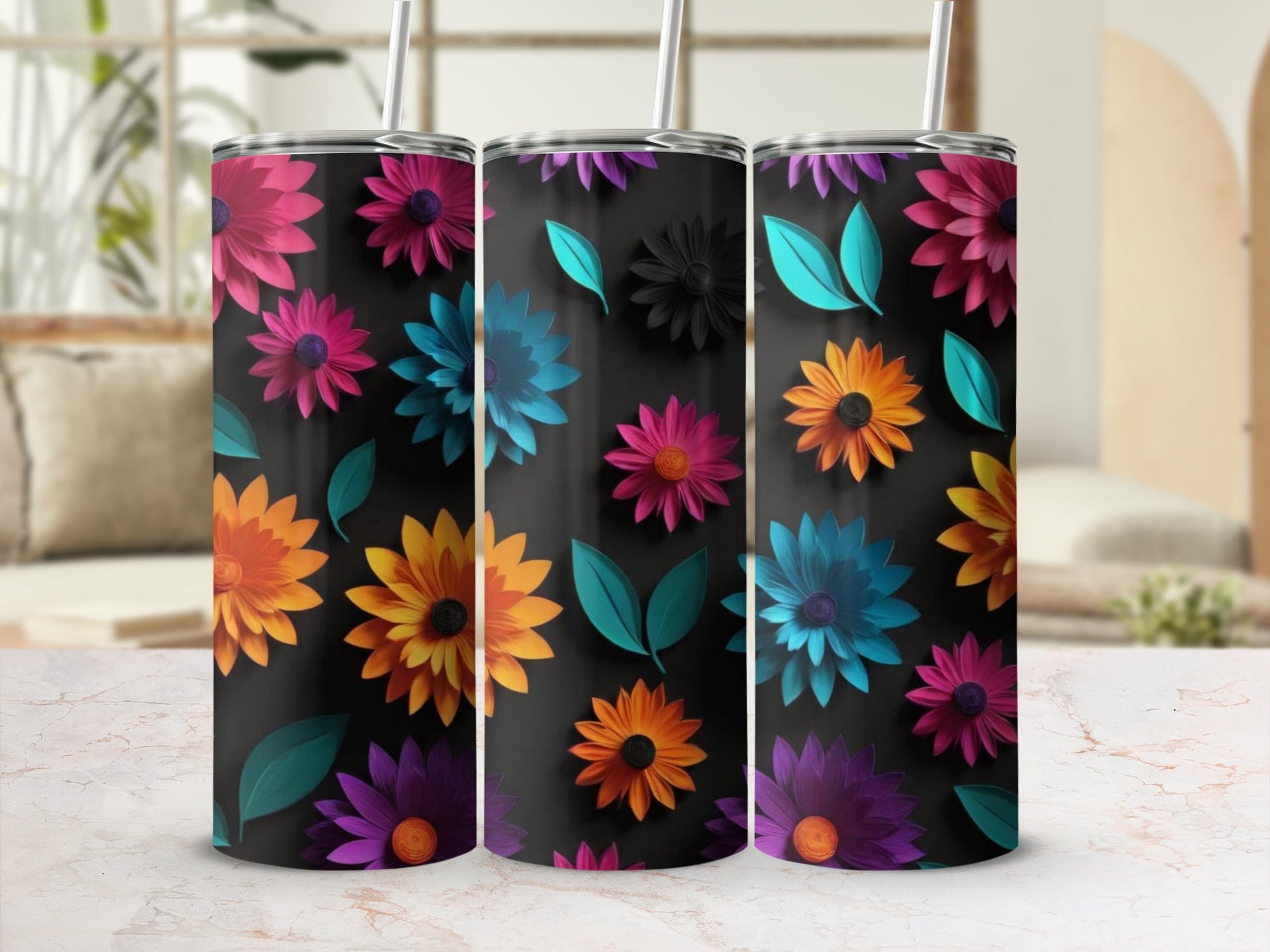 Three black tumblers adorned with vibrant, colorful floral designs and green leaves.