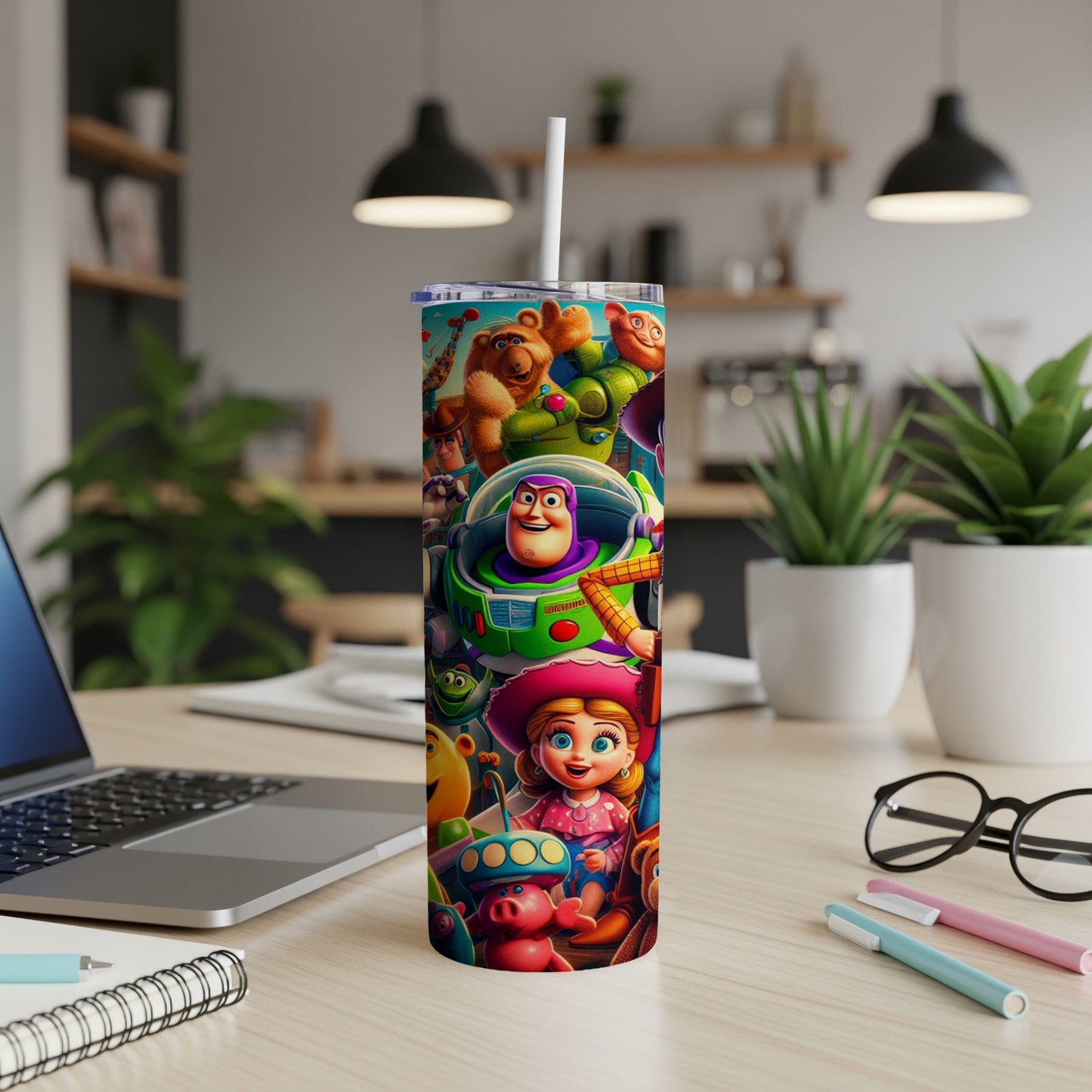 Toy Story characters on a white tumbler with a straw, on a desk.