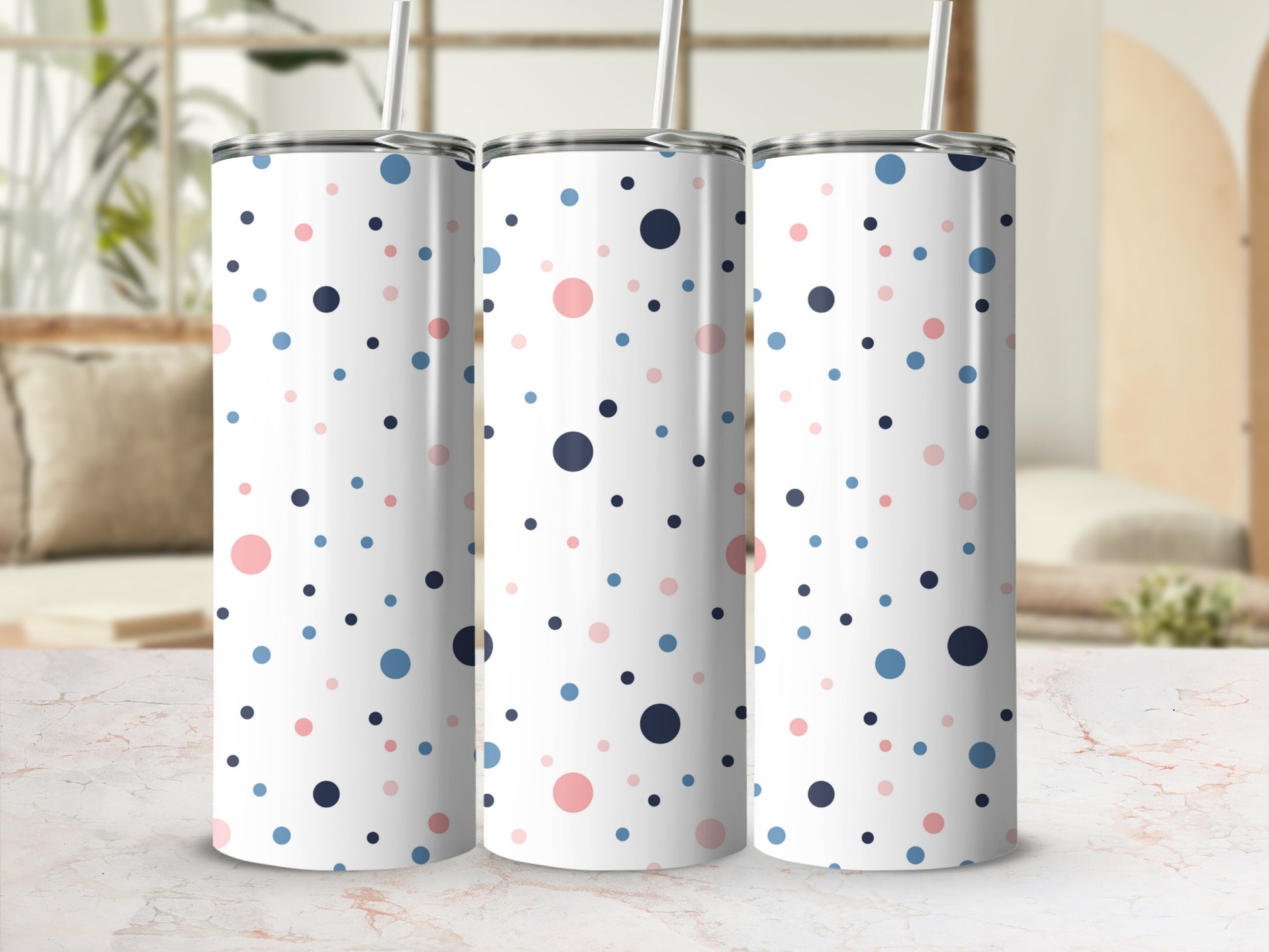 White tumbler with scattered pink, blue, and navy polka dots.