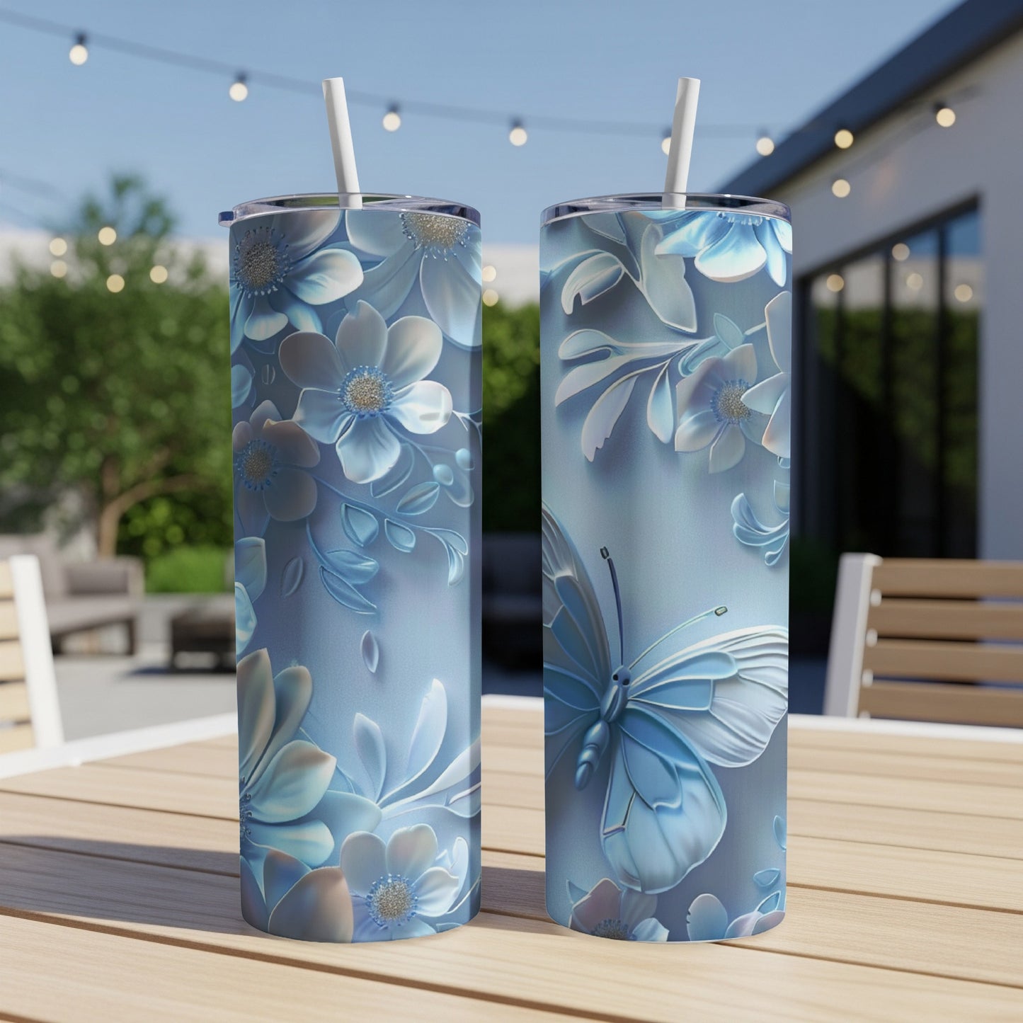 Two tall tumblers with a blue butterfly and floral pattern.