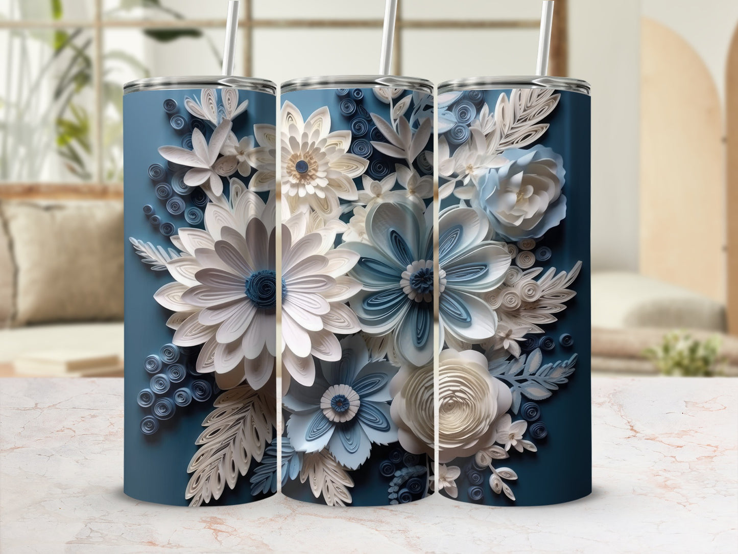 Three blue tumblers decorated with intricate paper flowers and leaves.