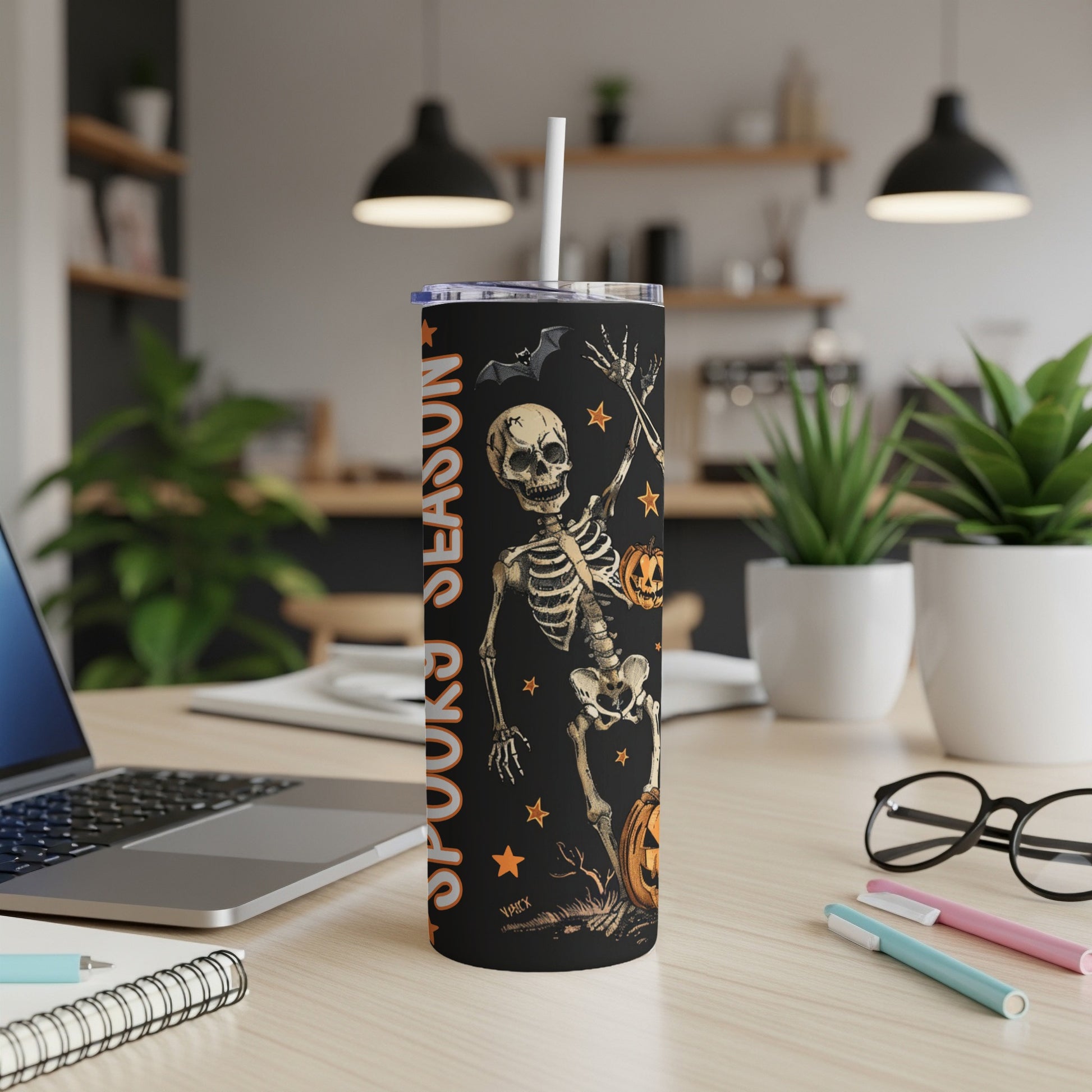 Black tumbler with Halloween skeleton, pumpkin, bat, and "Spooky Season" text.
