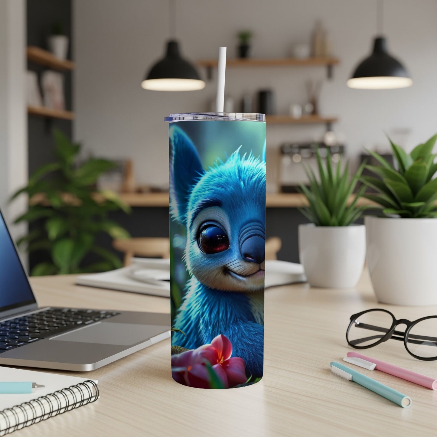 Blue cartoon alien character with large eyes on a white tumbler.