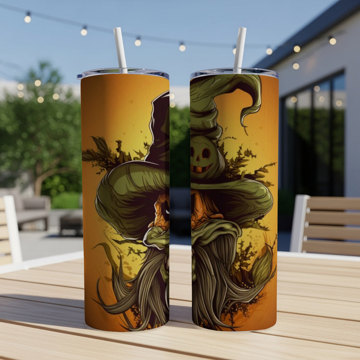 Two tumblers with Halloween witch and jack-o-lantern designs on an outdoor table.