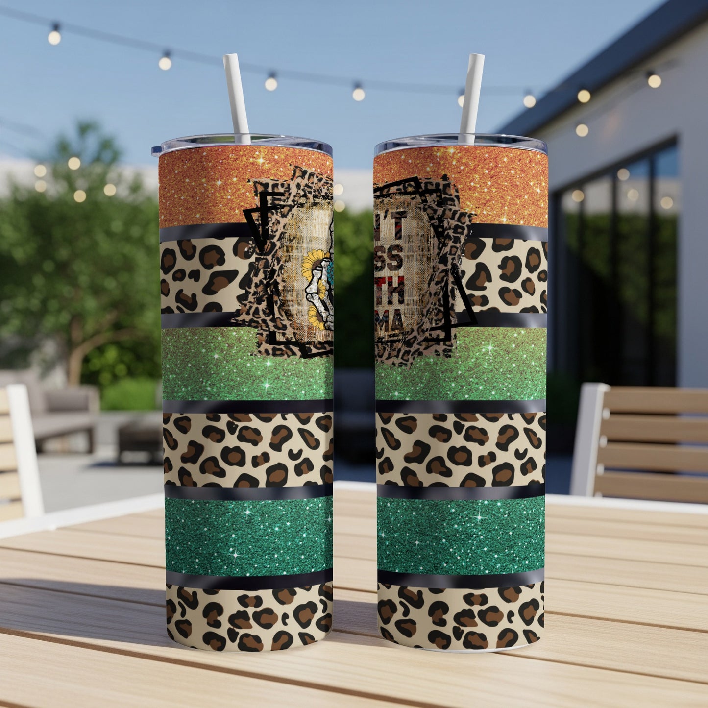 Two tumblers with leopard print, glitter, and text saying "Don't Mess With Mama".