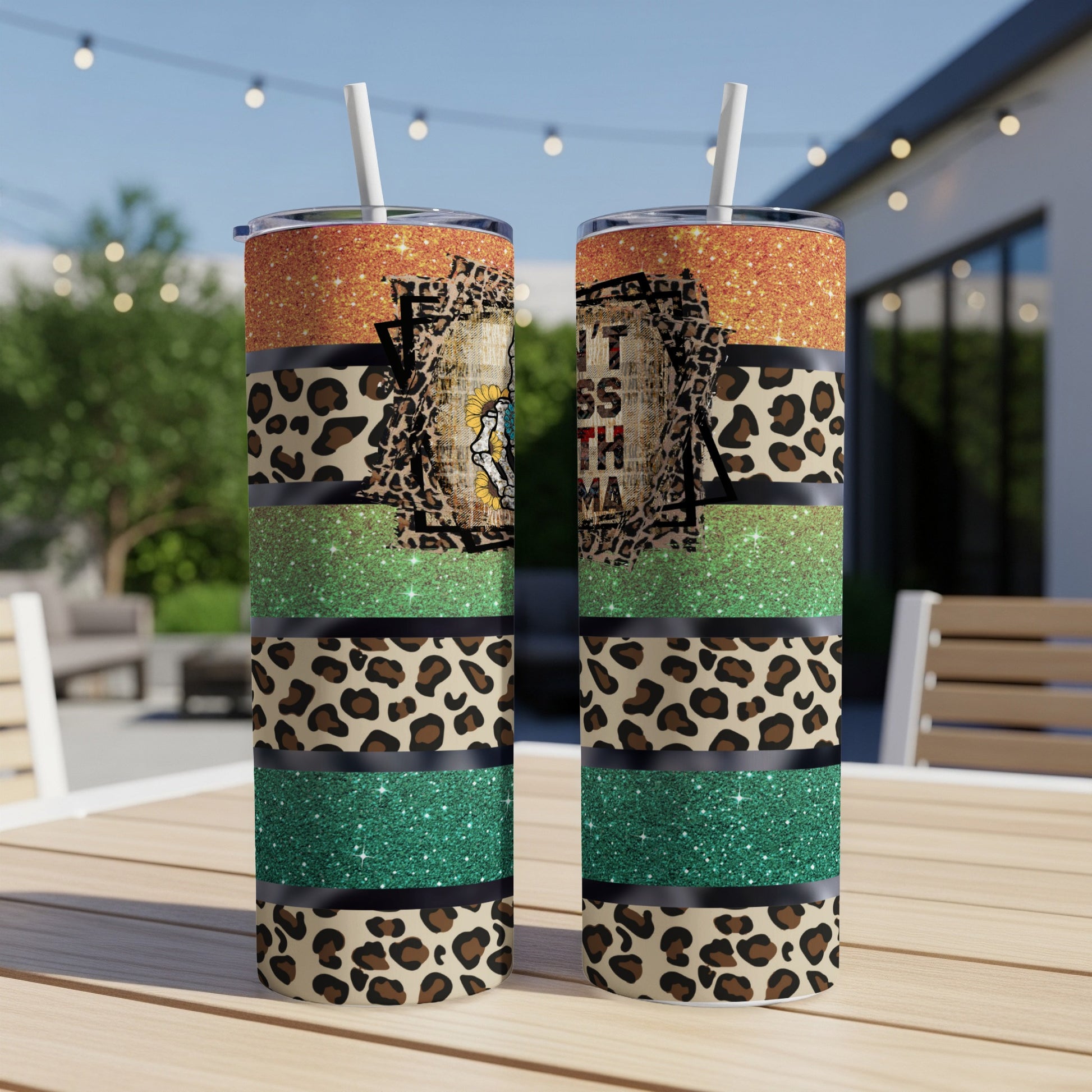 Two tumblers with leopard print, glitter, and text saying "Don't Mess With Mama".