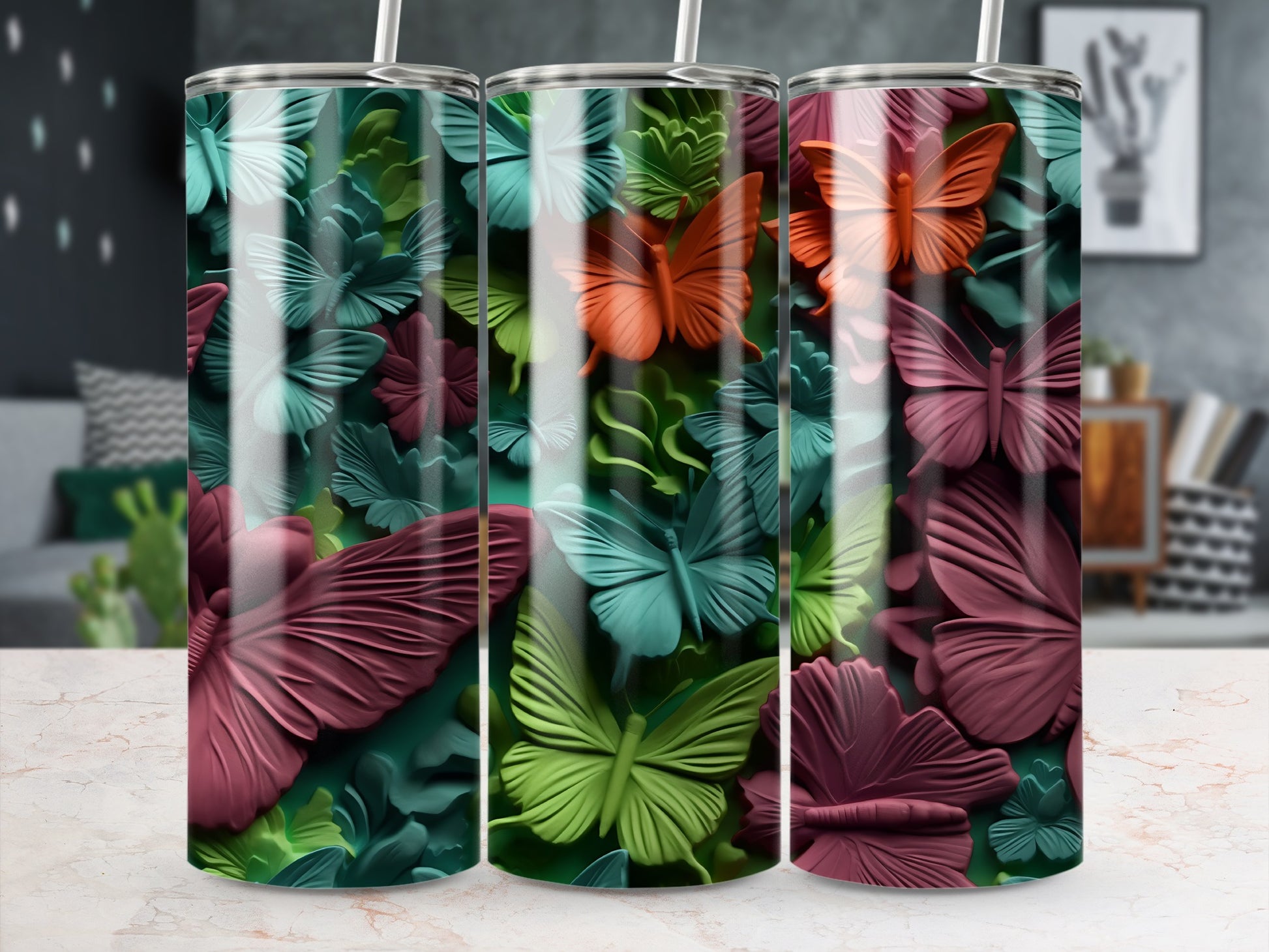 Three tumblers with a bold butterfly and floral embossed design.