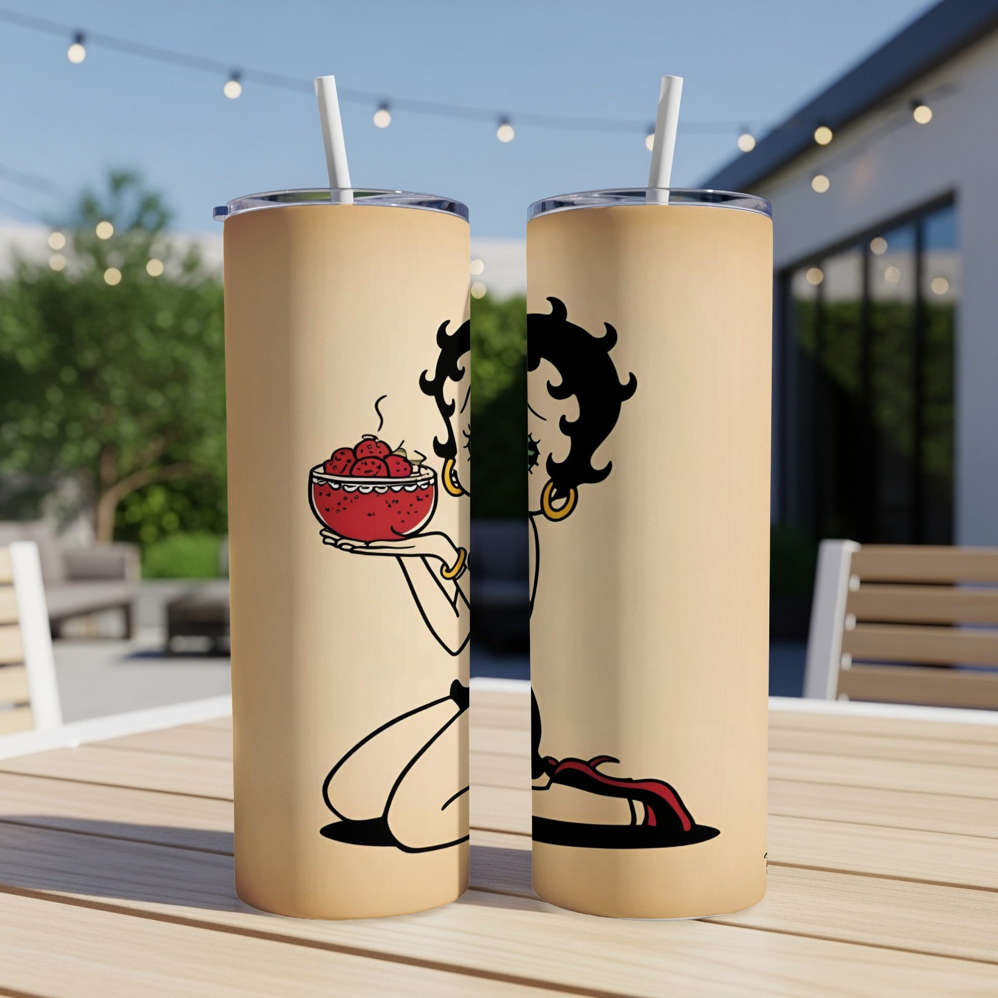Betty Boop holding a bowl of strawberries on a tan tumbler.