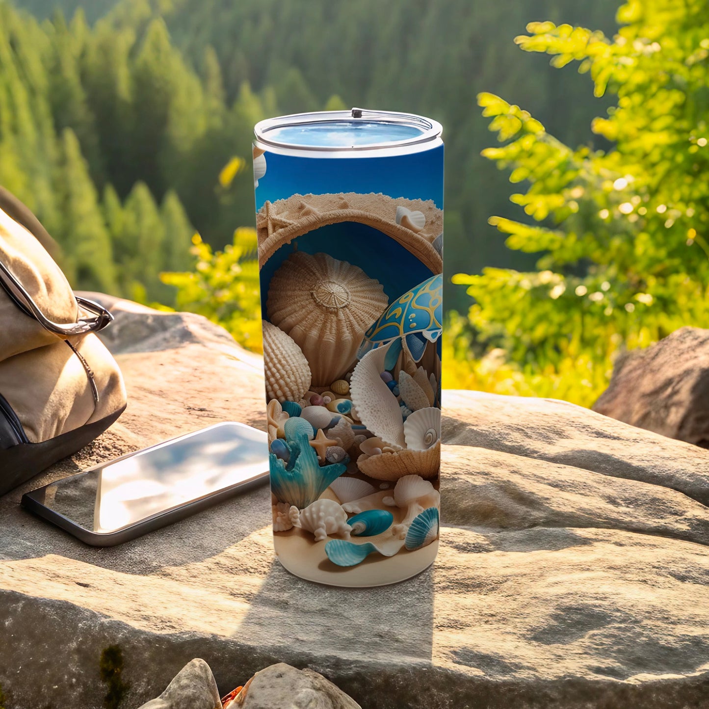 Beach scene with shells on a tumbler next to a phone and bag.