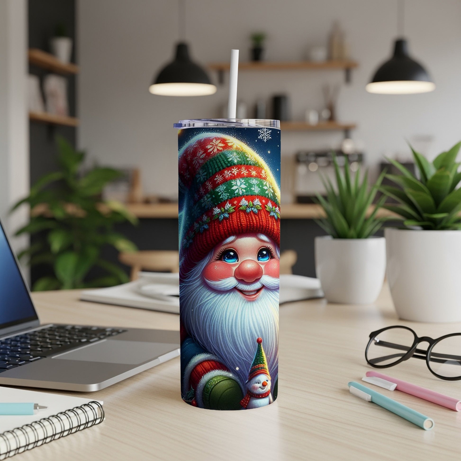 Santa Claus tumbler with snowman design, straw, and a blurred background.