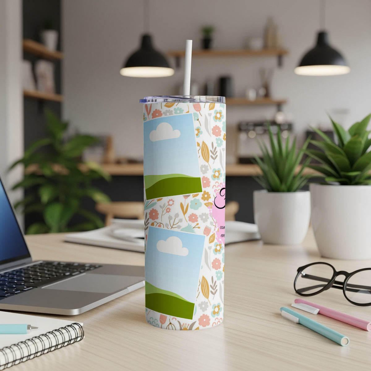 Tumbler with pastel floral pattern, two photo frames, and pink pig accent.