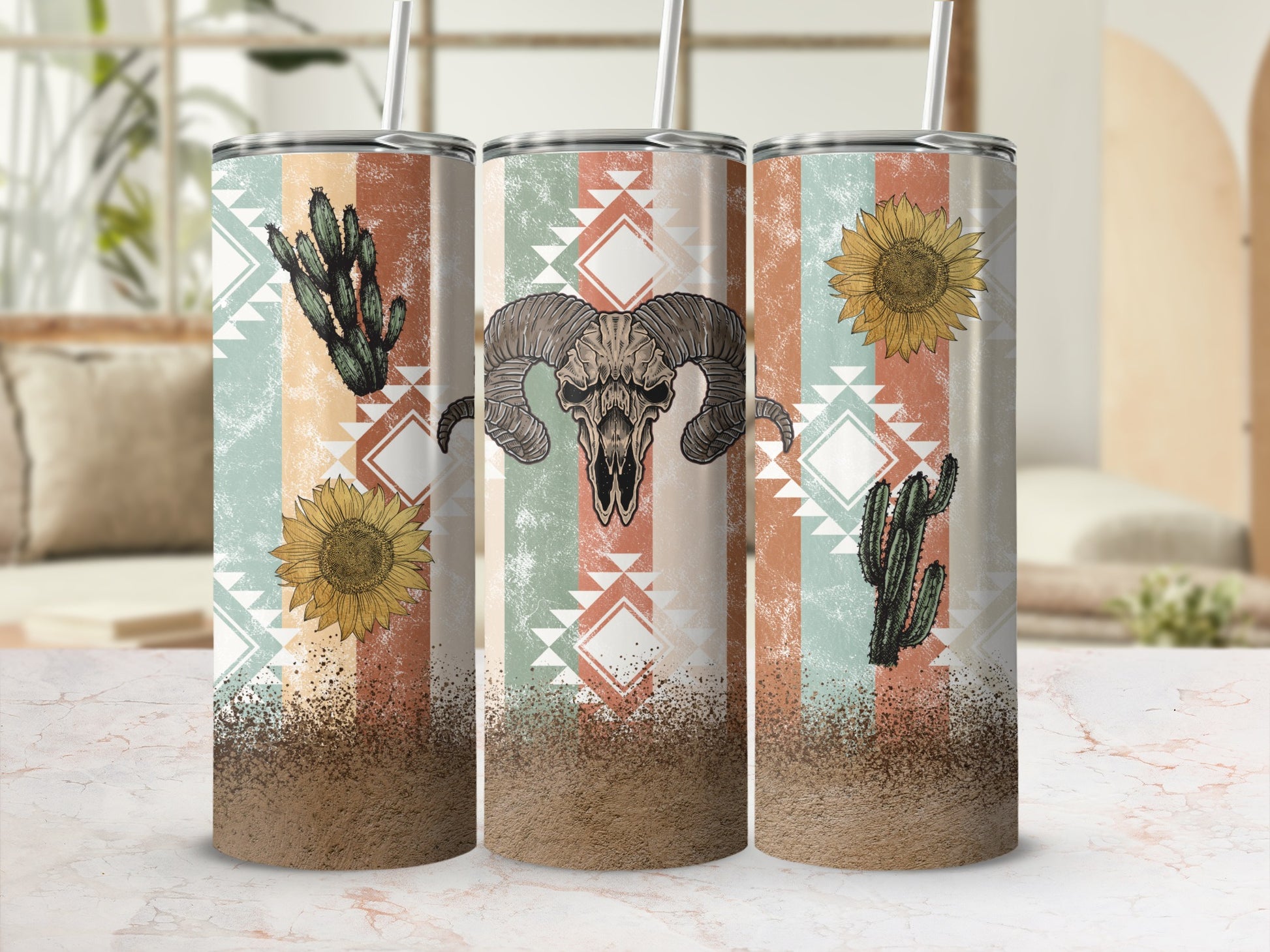 Three tumblers with skull, cactus, and sunflower Southwestern design.