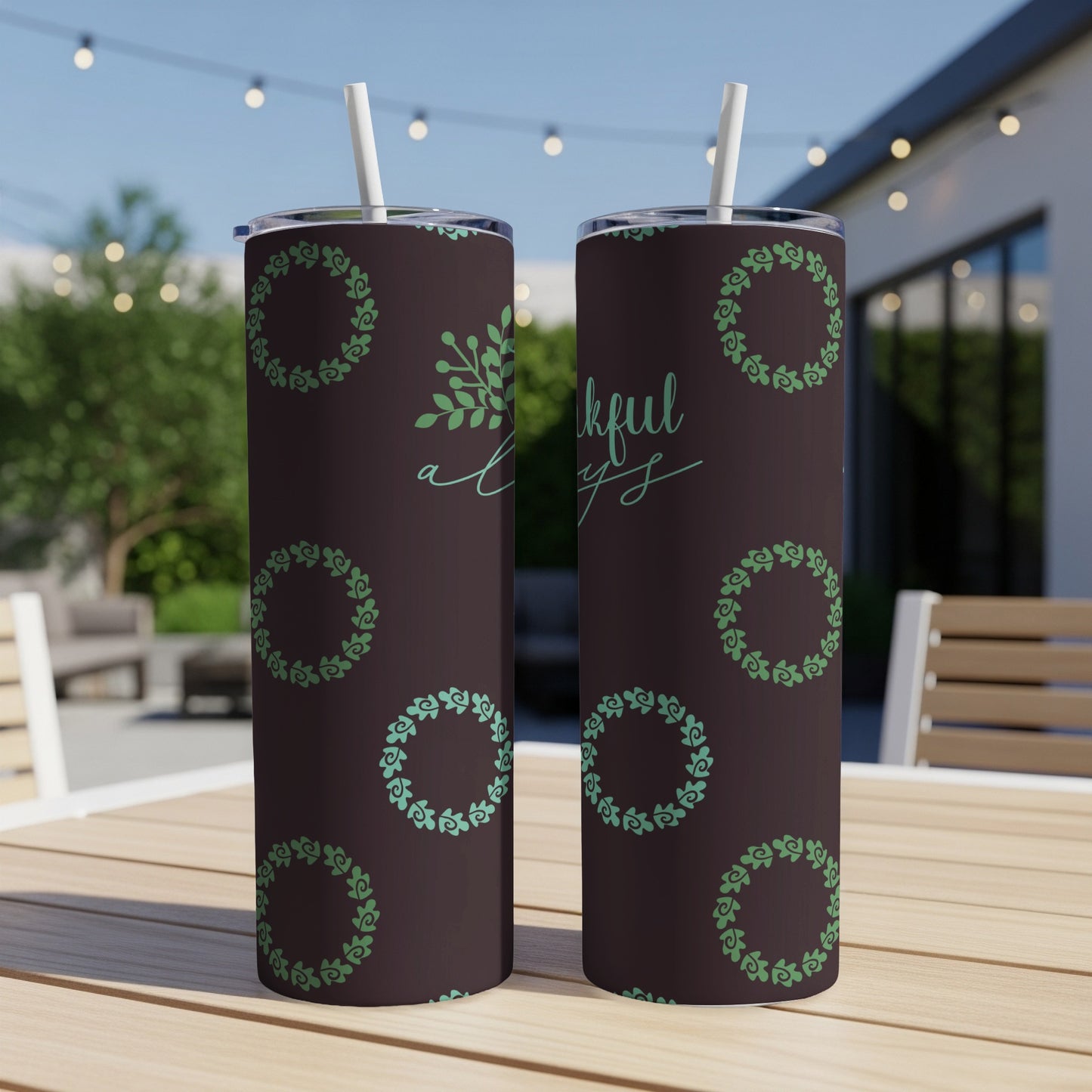 Dark brown tumbler with green wreath pattern and "thankful always" text.