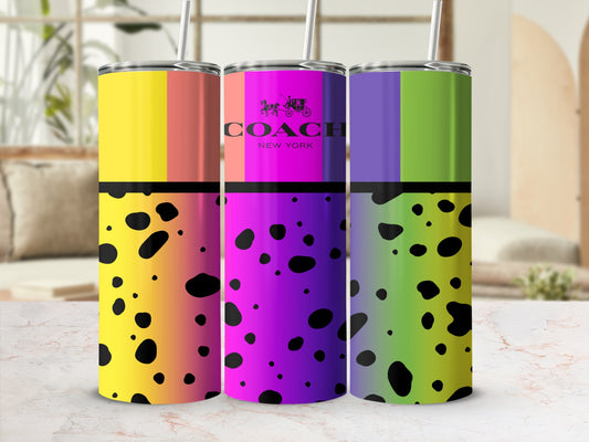 Three tumblers with gradient colors and black polka dots, one featuring the Coach logo.