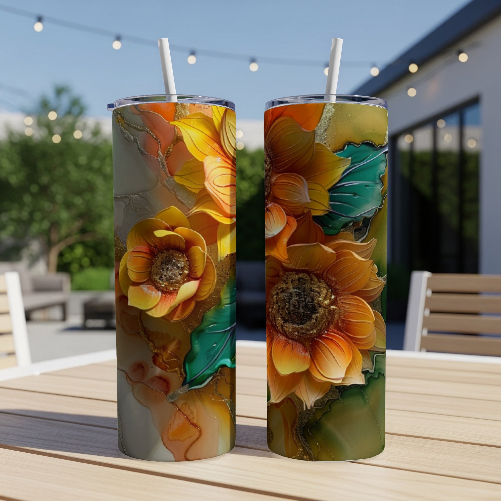 Two tumblers with embossed sunflower and marigold floral designs.