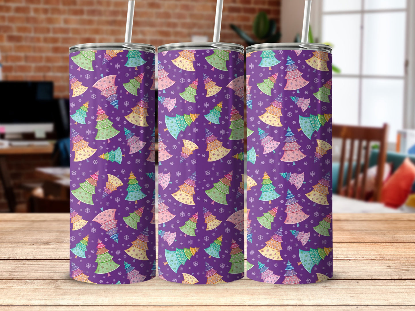 Three purple tumblers with colorful Christmas trees and snowflakes pattern.