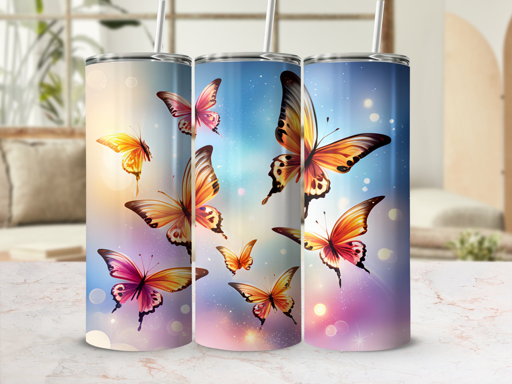 Three tumblers with colorful butterflies and bokeh effects.