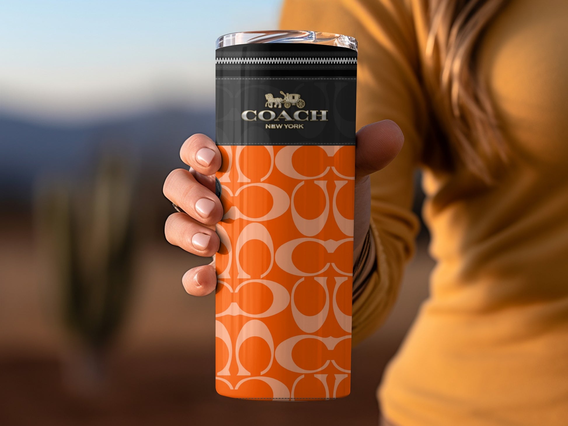 Coach New York Orange Travel Mug with Iconic Pattern