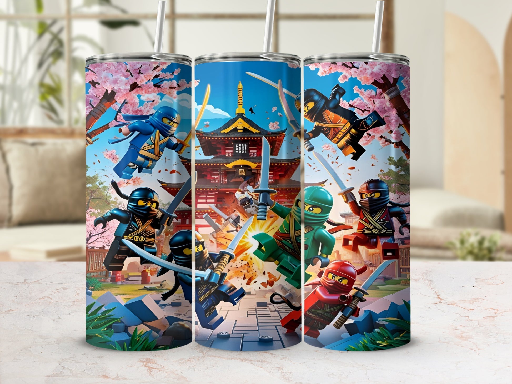 Three Ninjago tumblers in a display, featuring characters in action poses.