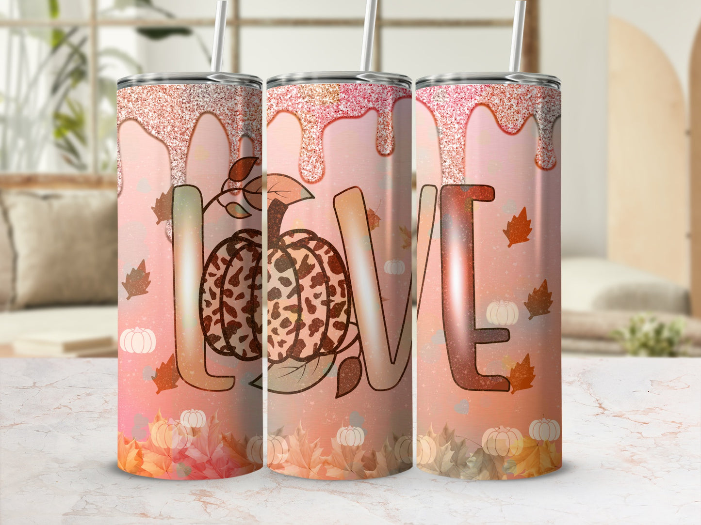 Tumbler with "LOVE" design, glitter drips, and falling autumn leaves.