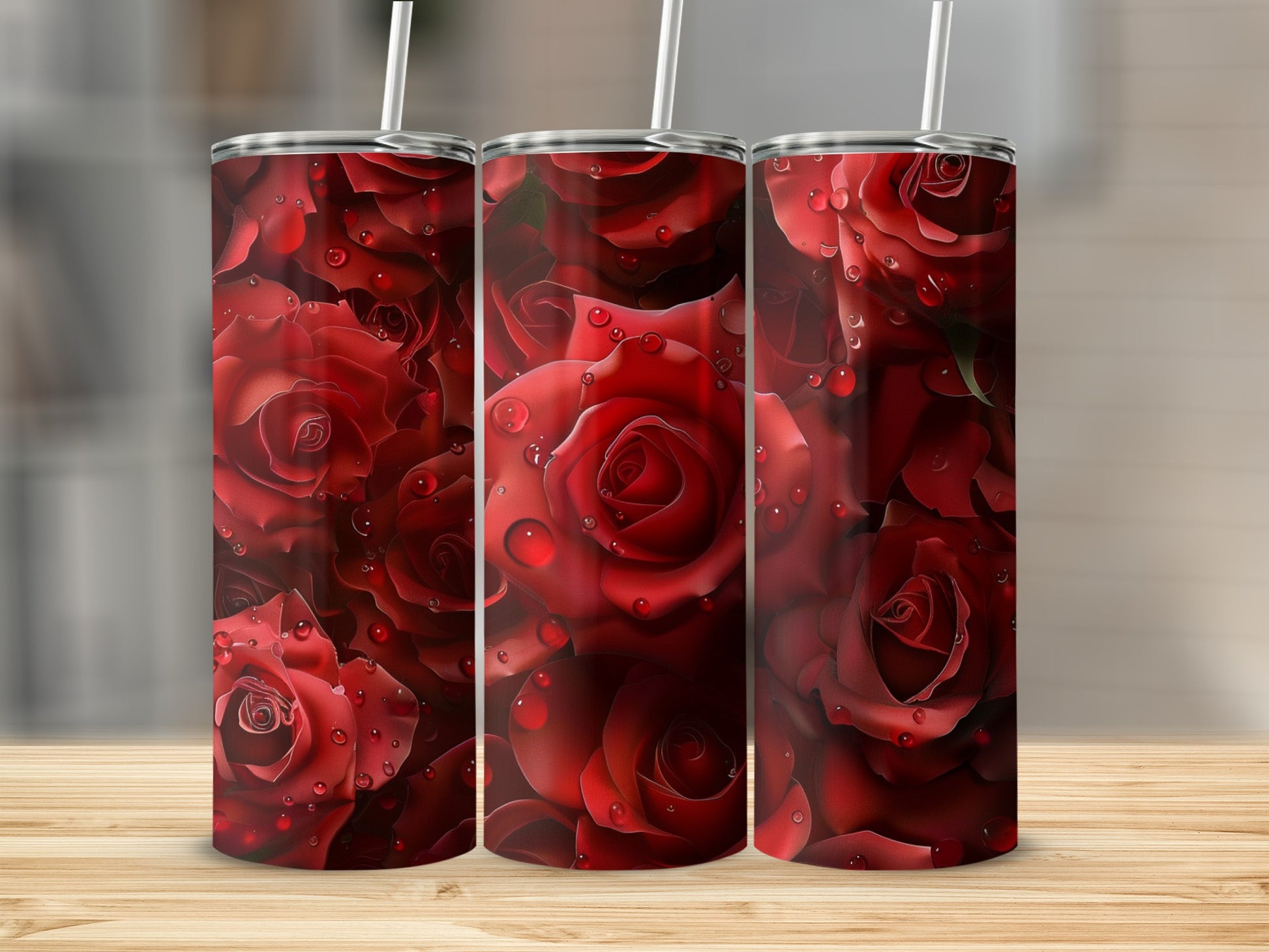 Three tumblers featuring a pattern of red roses with water droplets.