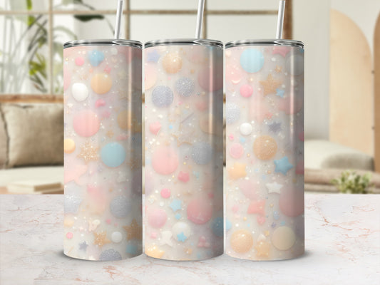 Three pastel tumblers with glittery star and dot patterns.